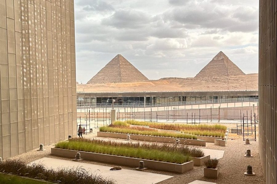 The Grand Egyptian Museum, a symbol of Egypt's cultural legacy, positioned in a frame that includes the Giza Pyramids