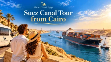 Couple overlooking a large cargo ship sailing through the Suez Canal in Egypt.